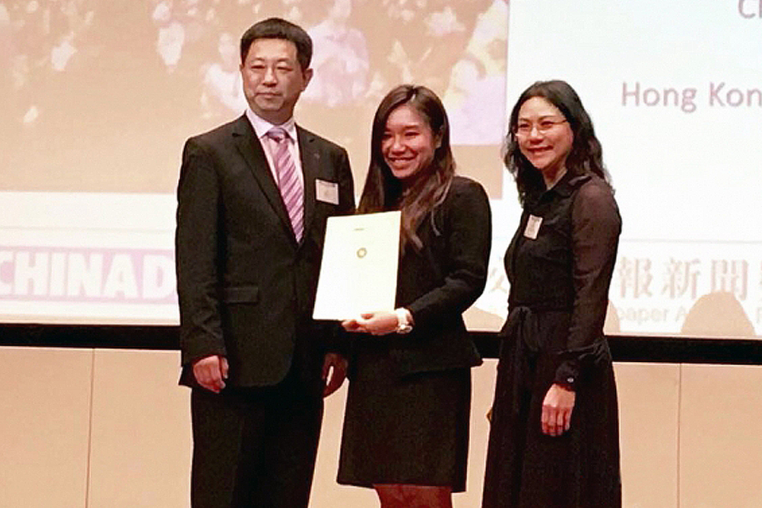 Christy Leung (centre), CIE alumnus, is winner in the Best in News Video Reporting category.