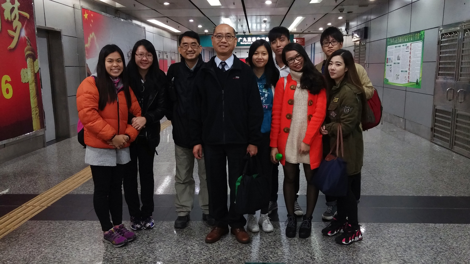 Prof. Siu Wai Sum, Programme Director of Bachelor of Commerce (Hons) in Marketing, HKBU (4th from the left), Dr. Martin Tsui, Advisor of CIE Lunar New Year Fair Team (3rd from the left) and the students met each other in Guangzhou railway station. 