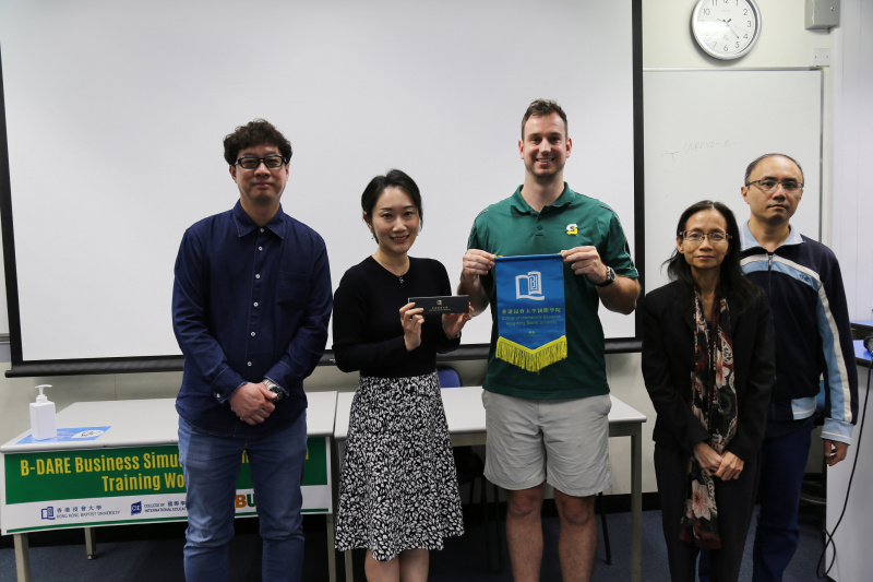The Division of Business including Dr. Connie Li, Division Leader (2nd left) and Mr. Eric Lau, Associate Programme Director  (Associate Degree) (1st left), expressed their gratitude to Mr. Jamie Lebrun for sponsoring the competition. 